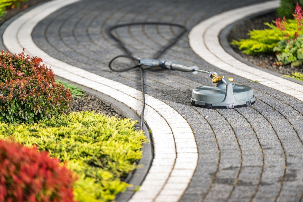 A,Pressure,Washer,Tool,Lies,On,A,Curved,Garden,Pathway,