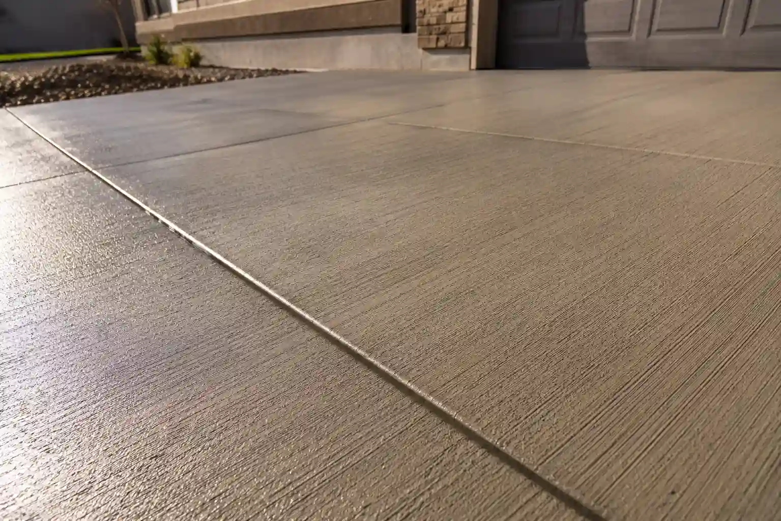 Smooth textured finish on a fresh surface estimating Concrete Driveway Cost.